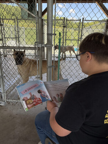 Top student readers turn pages into playtime for shelter animals